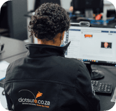 A Dotsure employee at his desk.