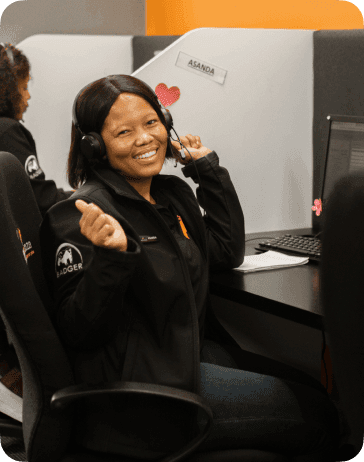 A happy Dotsure employee at her desk.