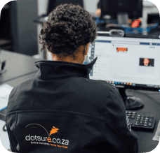 A Dotsure employee at his desk.