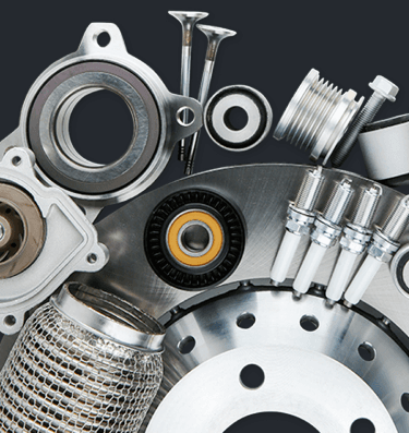 a photo of a collection of shiny gears and motor engine parts stacked upon each other